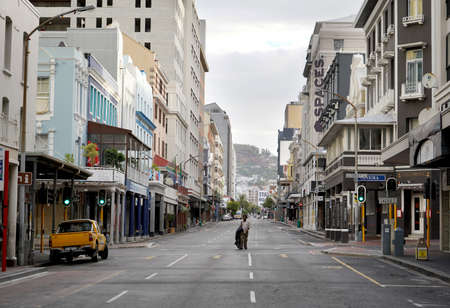 Cape Town, South Africa - 6 April 2020 : Empty streets and homeless man in Cape Town during the...