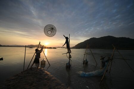 fisherman playful on riverのeditorial素材