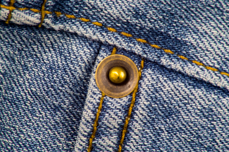 Close up of a Jeans with Rivet and Stitchingsの写真素材