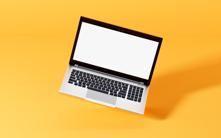 A laptop with yellow background, 3d rendering. Computer digital drawing.の写真素材