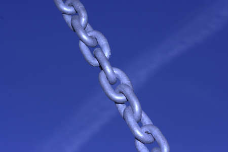 A Chain with a blue sky as a backgroundの写真素材