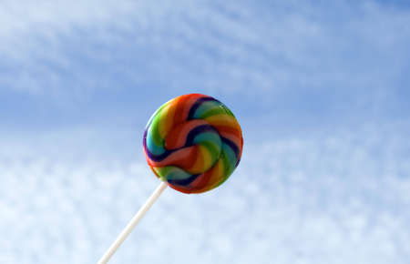 rainbow colored lollipopの写真素材