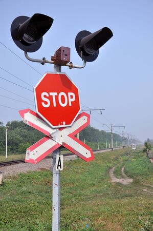 The sign of a stop at a railway crossing の写真素材