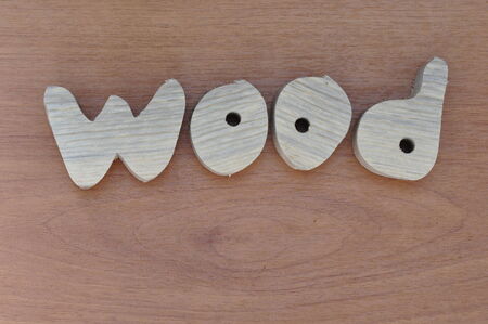 Letters carved out of wood の写真素材