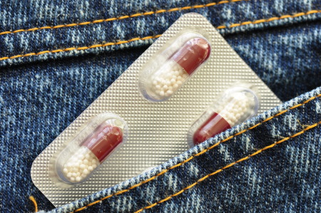 Capsules in the pocket of jeans.の写真素材