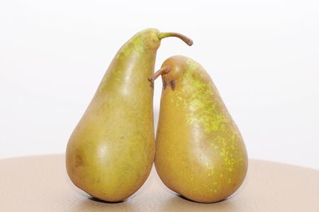 Two pears stand on tableの写真素材