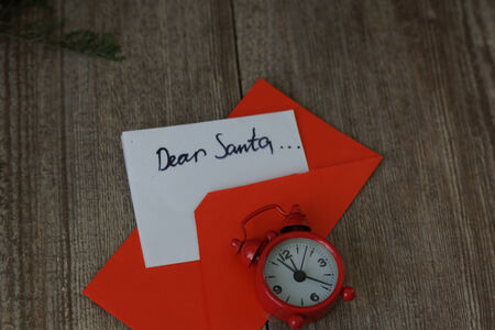 Merry Christmas note and clockの写真素材