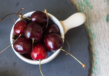 tasty summer fruits on a wooden table background