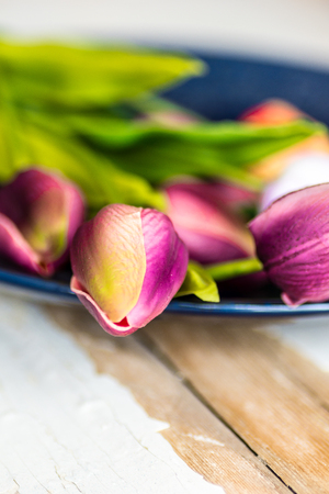 bouquet of colorful tulips on rustic wooden boardの写真素材
