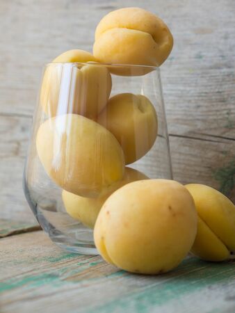 Fresh and ripe apricot fruits in the glassの写真素材