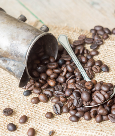 Coffee beans and vintage kettle and spoonsの写真素材