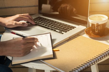 businessman working with laptop coffee on backgroundの写真素材