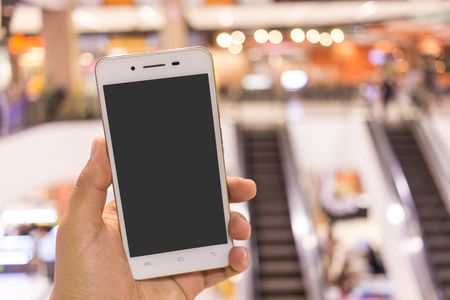 cellular telephone bokeh light background in Department store.の写真素材