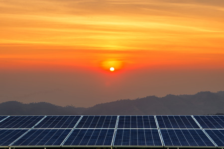 Solar panel on Sunrise Morning at mountain range view background.の写真素材