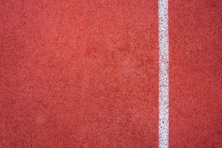Running track red ground rubber cover texture background.の写真素材