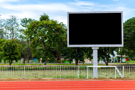 Digital blank scoreboard at football stadium with running track in sport stadium in outdoor ,Advertising Billboard LED, Empty black screen digital.の写真素材