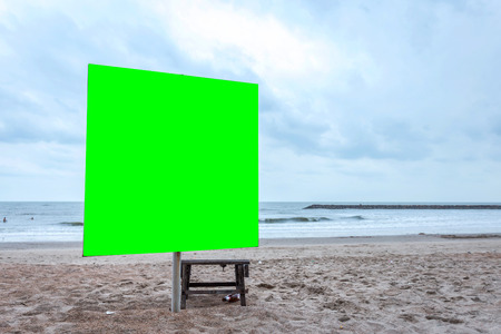 Green screen blank billboard ready for new advertisement at view on sea coast,Tropical beach.の写真素材