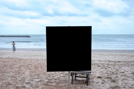 Black blank billboard ready for new advertisement at view on sea coast,Tropical beach.の写真素材