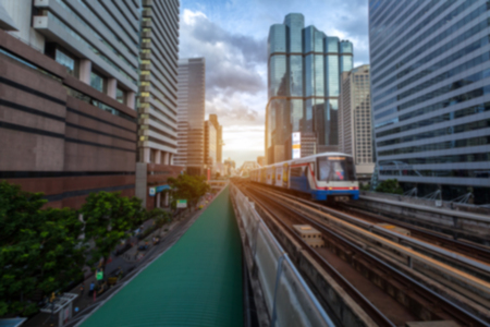 Background blur of the BTS Skytrain in Bangkok with evening sunset