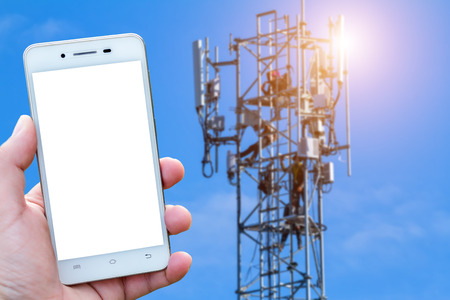 Men use smartphone blurred images in Antenna on communication or electricity tower radio mast with...