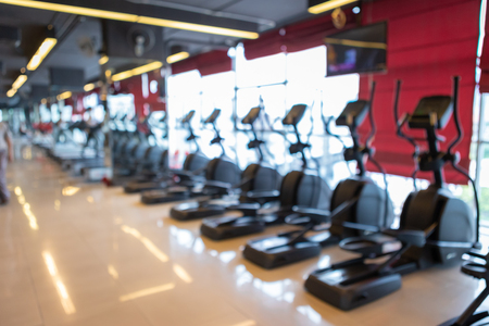 Abstract blur of defocused sport gym interior and fitness health club with sports exercise equipment. Gym blur background.の写真素材