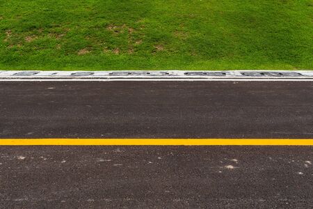 Asphalt road with marking lines white stripes texture Backgroundの写真素材