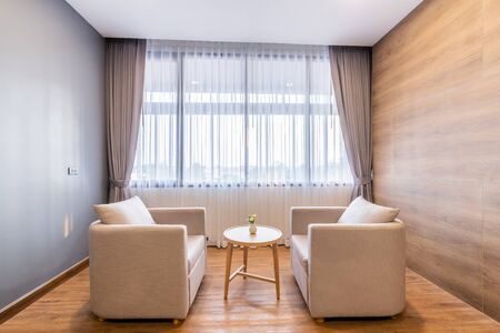 Close-up of sofa in hotel bedroom interior.