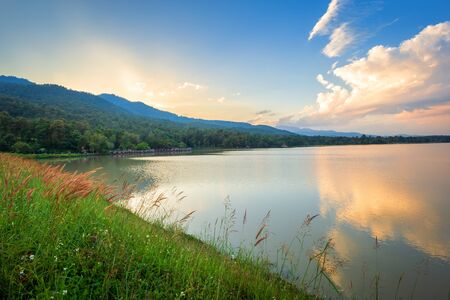 Scenic view of the reservoir Huay Tueng Tao with Mountain range forest at evening sunset in Chiang Mai, Thailandの写真素材