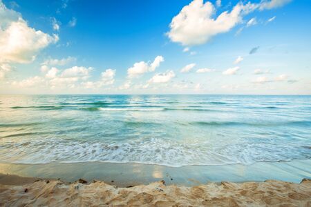 Beautiful early morning sunrise over and Wave of the sea on the sand beach the horizon at Hat chao lao beach in Chanthaburi Thailand.の写真素材