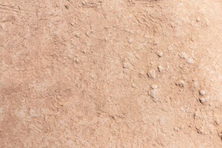 Brown dry soil or cracked ground texture background.