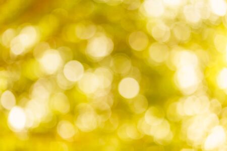 golden yellow bokeh background with circles. Summer abstract theme.の写真素材