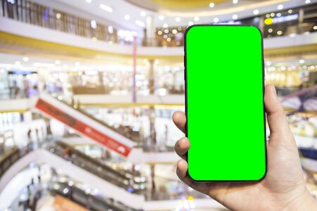 Close-up of female use Hand holding smartphone blurred images touch of Abstract blur of inside...