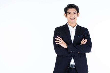 fashion Portrait of handsome young Asian man with arms folded  isolated on white grey blank copy space studio background,Business success conceptの写真素材