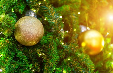 Close up of Colorful balls on Green Christmas tree background Decoration During Christmas and New Year.の写真素材