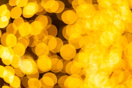 Yellow Colorful light Abstract circular bokeh of Christmas tree background Decoration During Christmas and New Year.の写真素材