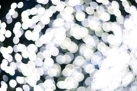 White Colorful light Abstract circular bokeh of Christmas tree background Decoration During...