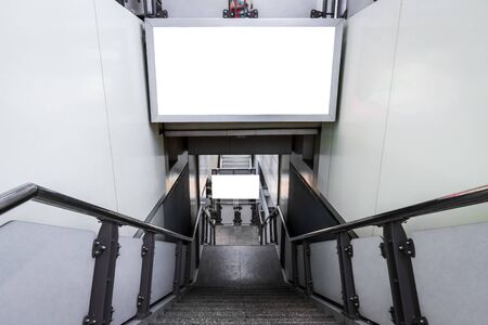 Blank billboard ready for new advertising for customer information services on the stairs outdoors at skytrain station,Business marketing conceptsの写真素材