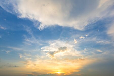 blue bright and orange yellow dramatic sunset sky in countryside texture background.の写真素材