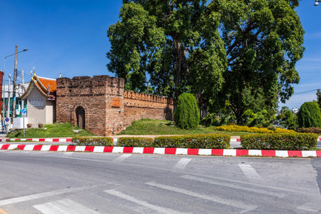 Tha Phae Gate Chiang Mai old town city and street ancient wall at moat (Chiang Mai Gate) is a major tourist attraction in Chiang Mai Northern Thailand.blue skyの写真素材