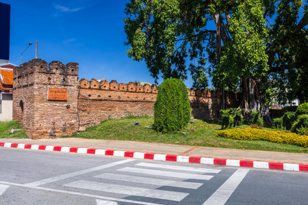 Tha Phae Gate Chiang Mai old town city and street ancient wall at moat (Chiang Mai Gate) is a major tourist attraction in Chiang Mai Northern Thailand.blue skyの写真素材