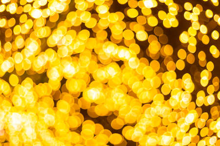 Yellow Colorful light Abstract circular bokeh of Christmas tree background Decoration During Christmas and New Year.の写真素材