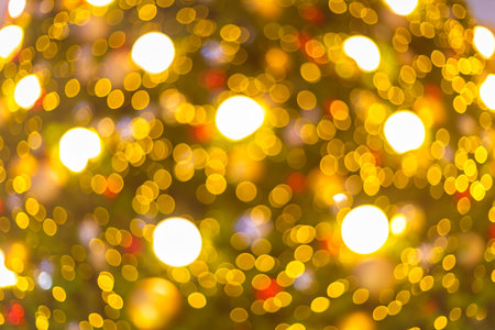 Yellow Colorful light Abstract circular bokeh of Christmas tree background Decoration During Christmas and New Year.の写真素材