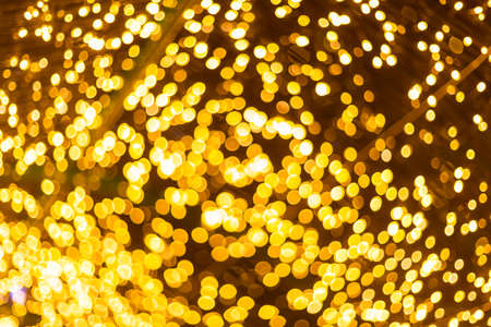 Yellow Colorful light Abstract circular bokeh of Christmas tree background Decoration During Christmas and New Year.の写真素材