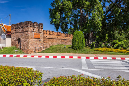 Tha Phae Gate Chiang Mai old town city and street ancient wall at moat (Chiang Mai Gate) is a major tourist attraction in Chiang Mai Northern Thailand.blue skyの写真素材