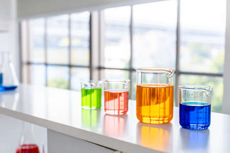 test tubes with lab glassware on the table in laboratory background, research and Scientific conceptの写真素材