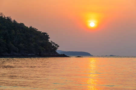 Beautiful early sunset over and Wave of the sea on the sand beach the horizon Summer time at hat sai kaew beach in Chanthaburi Thailand.の写真素材