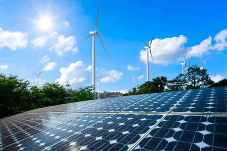 Photovoltaic modules solar power plant with wind turbines against and blue sky with cloud,alternative clean energy concept.の写真素材