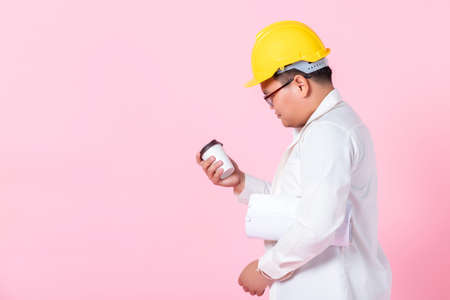 Industry worker or engineer working an architect builder studying layout plan serious civil engineer...