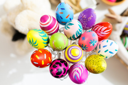 Easter holiday concept,Colorful Easter eggs in egg box,basket Easter eggs on white pastel color rustic wood background with space.の写真素材