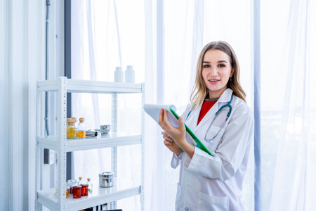 young female doctor therapeutic advising with positive emotions hold clipboard  up with smiley face very good on wooden table in Hospital backgroundの写真素材